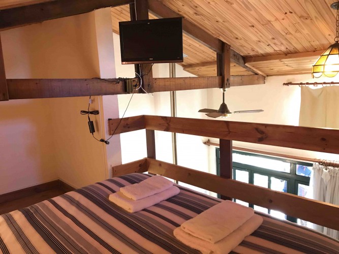 img/inmuebles/haras_4_cama_y_tv.jpg